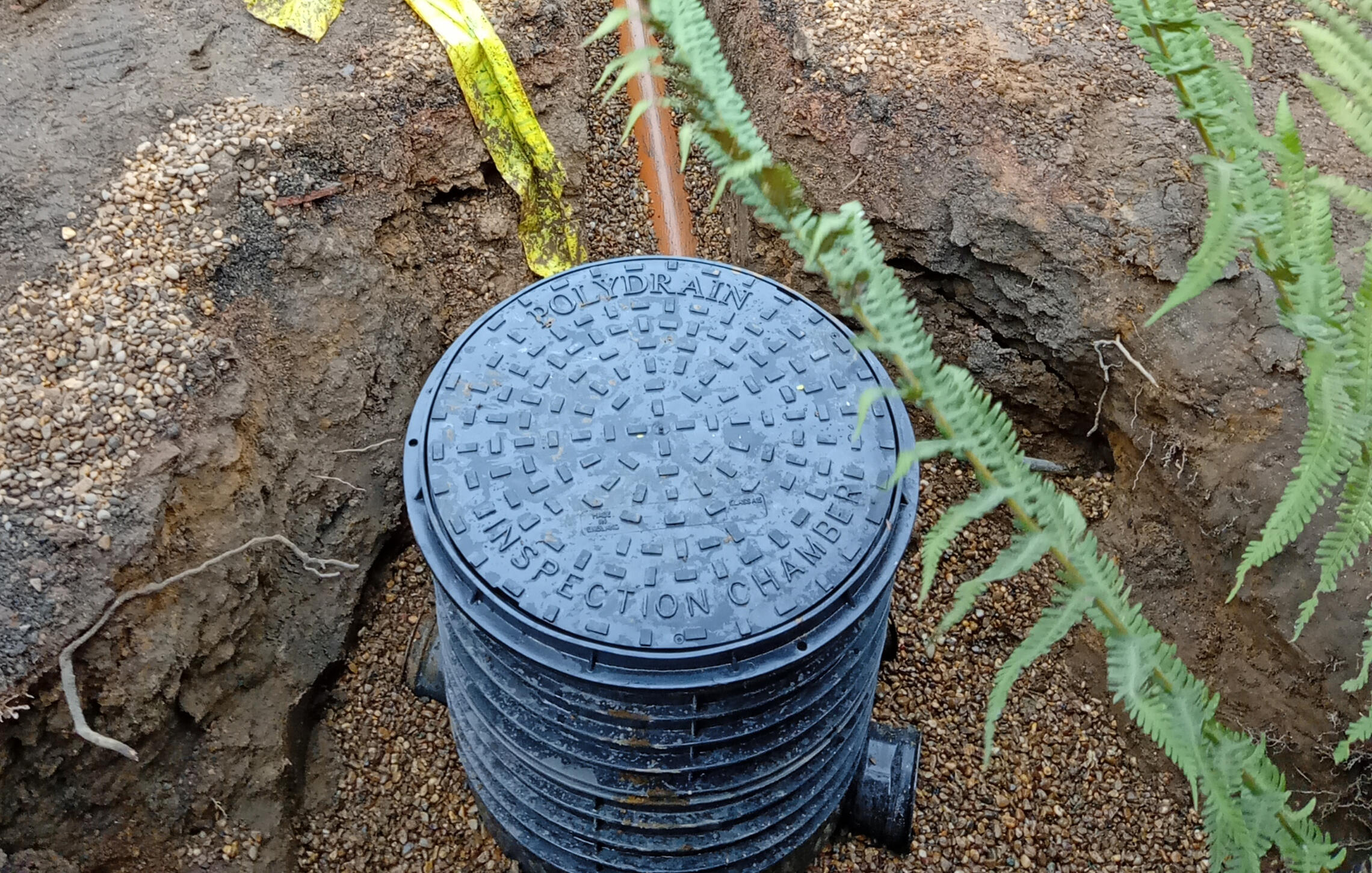 Drainage run and inspection chamber checked before backfilling during extension groundworks in Doncaster